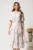 Rochie midi roz cu flori turcoaz din viscoza in clos cu pliuri pe bust