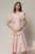 Rochie midi roz de ocazie cu aplicatie in talie cu margele si maneci decupate