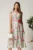 Rochie midi roz din viscoza cu imprimeuri verzi in clos cu floare in talie