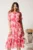 Rochie midi roz din voal in clos cu imprimeuri florale fucsia