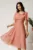 Rochie midi roz din voal in clos cu insertii din fir lurex si flori la decolteu
