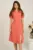 Rochie midi roz piersica din crep in clini cu floare la bust- Moze