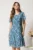 Rochie midi turcoaz cu mov din voal in clin cu fir lurex si decupaje la decolteu
