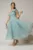 Rochie midi turcoaz din organza cu pietre strass si funda ampla pe umar