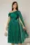 Rochie midi verde de ocazie din voal peliculizat cu o maneca ampla si brosa pe talie