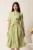 Rochie midi verde in clos cu imprimeu alb si cordon in talie