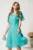 Rochie midi verde mint din voal in clin cu buline si decupaje la decolteu
