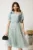 Rochie midi verde mint din voal in clos cu buline catifelate si floare pe bust- Viada