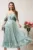 Rochie midi verde mint in clos din voal satinat cu aplicatii cazute pe umeri