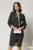 Rochie neagra cu buline cu snur la guler si maneci usor bufante