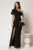 Rochie neagra lunga de ocazie pe un umar cu volanas si slit pe picior