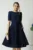 Rochie office din stofa bleumarin cu floare maxi pe talie