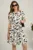 Rochie scurta alba din voal in clos cu imprimeu floral negru- Moze