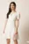 Rochie scurta alba in clin cu decolteu petrecut- Moze