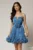 Rochie scurta albastra din voal in clos cu volanase si floare maxi pe talie