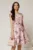 Rochie scurta roz in clos cu imprimeu floral mov si curea in talie