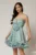 Rochie scurta verde mint din voal in clos cu volanase si floare maxi pe talie