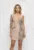 Rochie tip sacou de culoare bej prevazuta cu broderie pretioasa si perle
