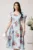 Rochie vaporoasa din satin bleu cu trandafiri roz
